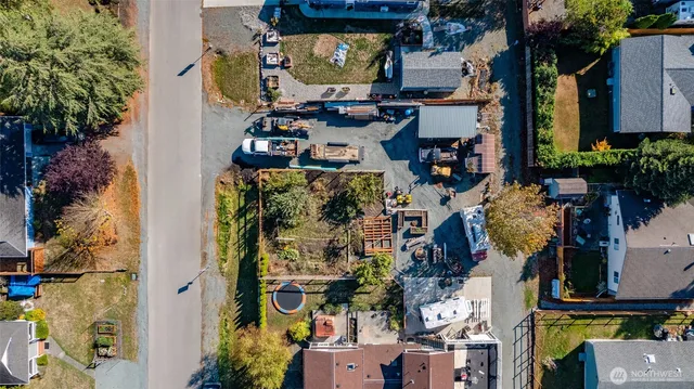 an aerial view of multi story residential apartment building with outdoor space