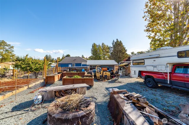 a view of a balcony with wooden floor and outdoor space