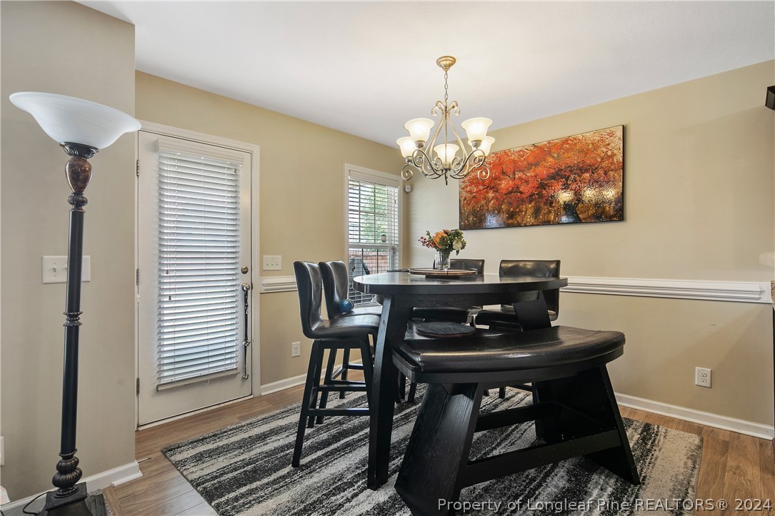 Undisclosed Address Hope Mills, NC 28348 - Photo 14 of 46 a view of a dining room with furniture and chandelier