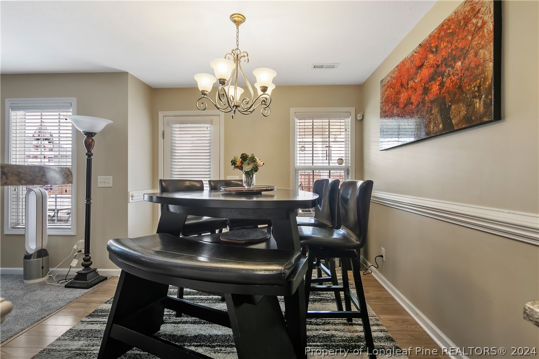 Undisclosed Address Hope Mills, NC 28348 - Photo 15 of 46 a view of a dining room with furniture and window