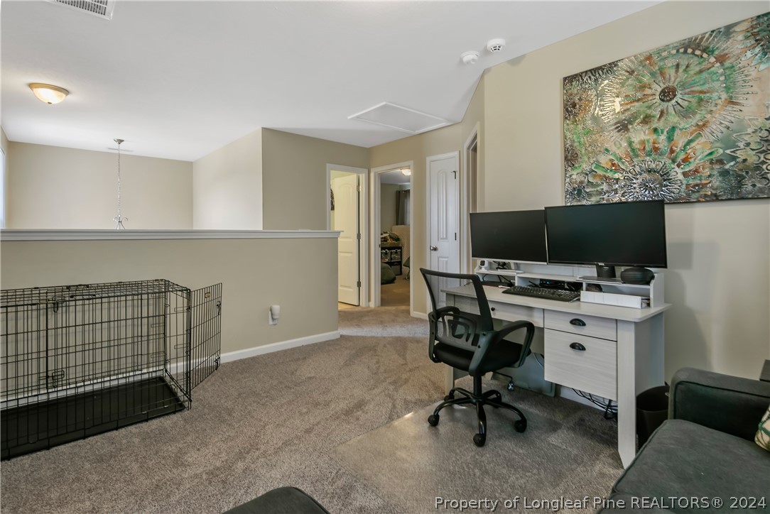 Undisclosed Address Hope Mills, NC 28348 - Photo 24 of 46 a view of workspace with windows tv cabinet