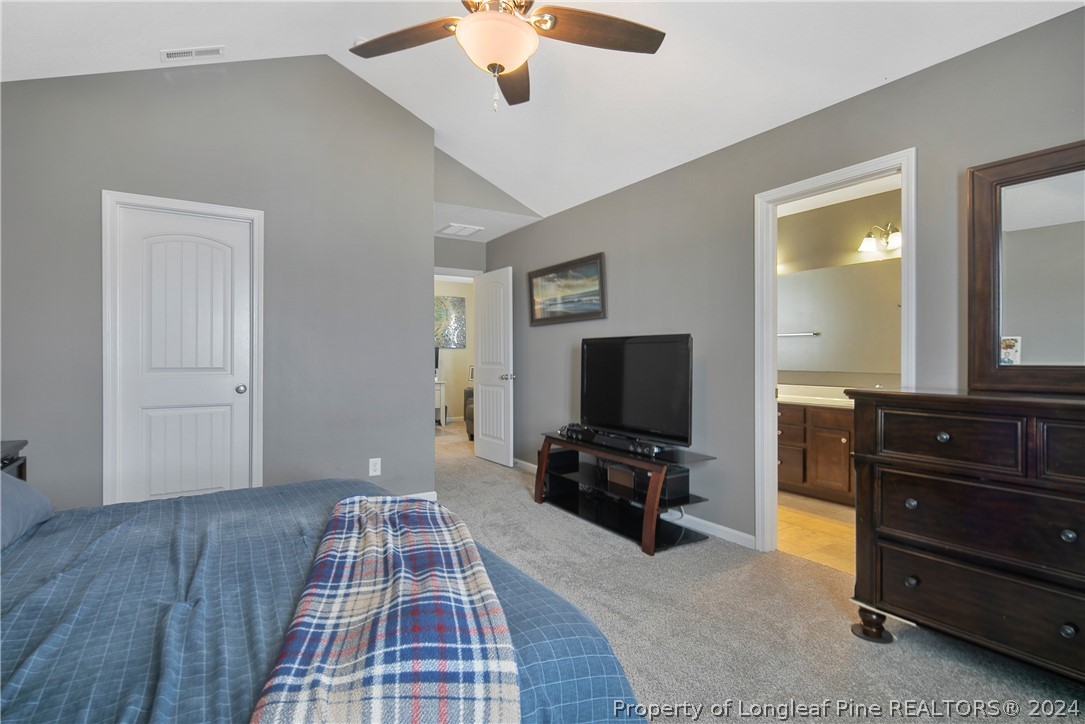 Undisclosed Address Hope Mills, NC 28348 - Photo 28 of 46 a bedroom with a bed and wooden floor