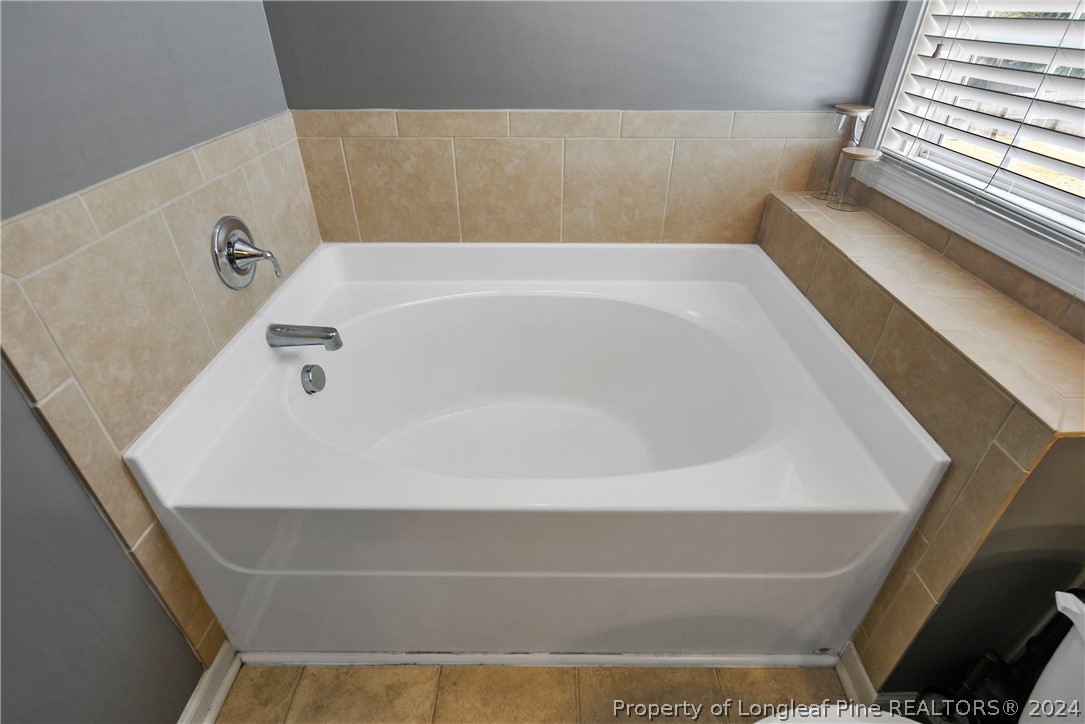 Undisclosed Address Hope Mills, NC 28348 - Photo 33 of 46 a bathroom with a bathtub