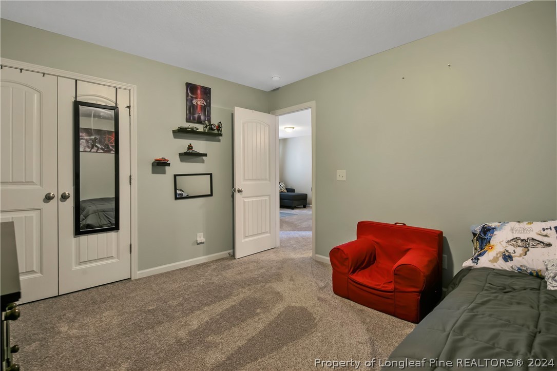 Undisclosed Address Hope Mills, NC 28348 - Photo 36 of 46 a bedroom with furniture and a bed