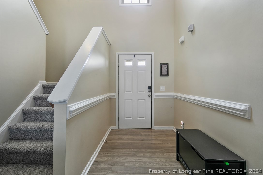 Undisclosed Address Hope Mills, NC 28348 - Photo 6 of 46 a view of entryway and hall with wooden floor