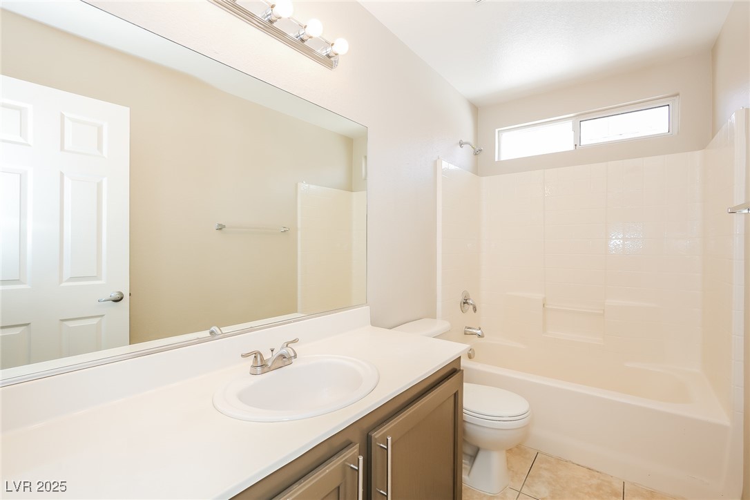 7202 Cestrum Road Las Vegas, NV 89113 - Photo 12 of 15 Bathroom featuring toilet, tile patterned floors,