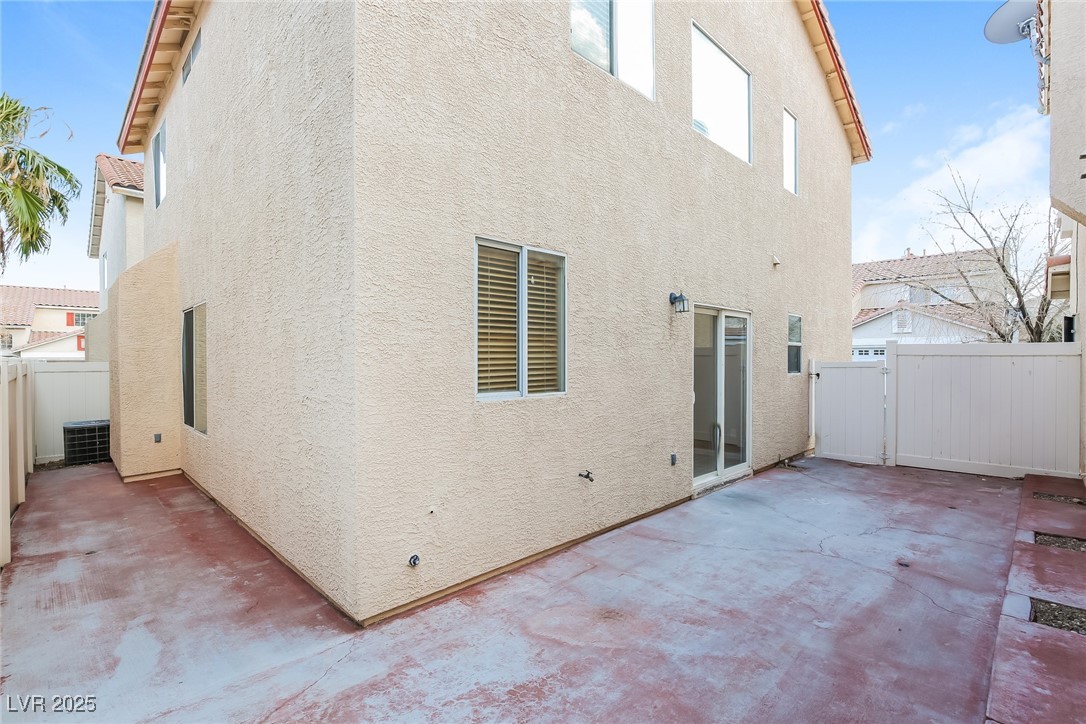 7202 Cestrum Road Las Vegas, NV 89113 - Photo 13 of 15 Rear view of house featuring a tiled roof, fence,