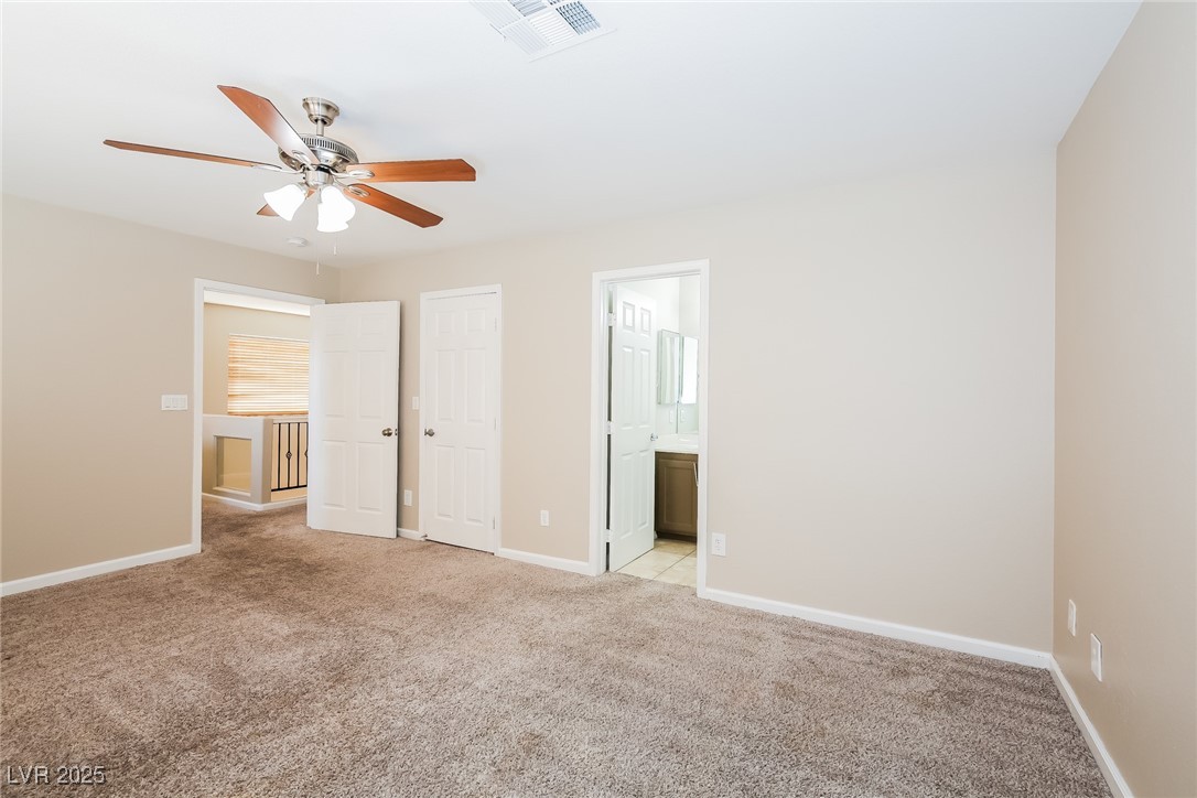 7202 Cestrum Road Las Vegas, NV 89113 - Photo 8 of 15 Unfurnished bedroom featuring visible vents, baseb
