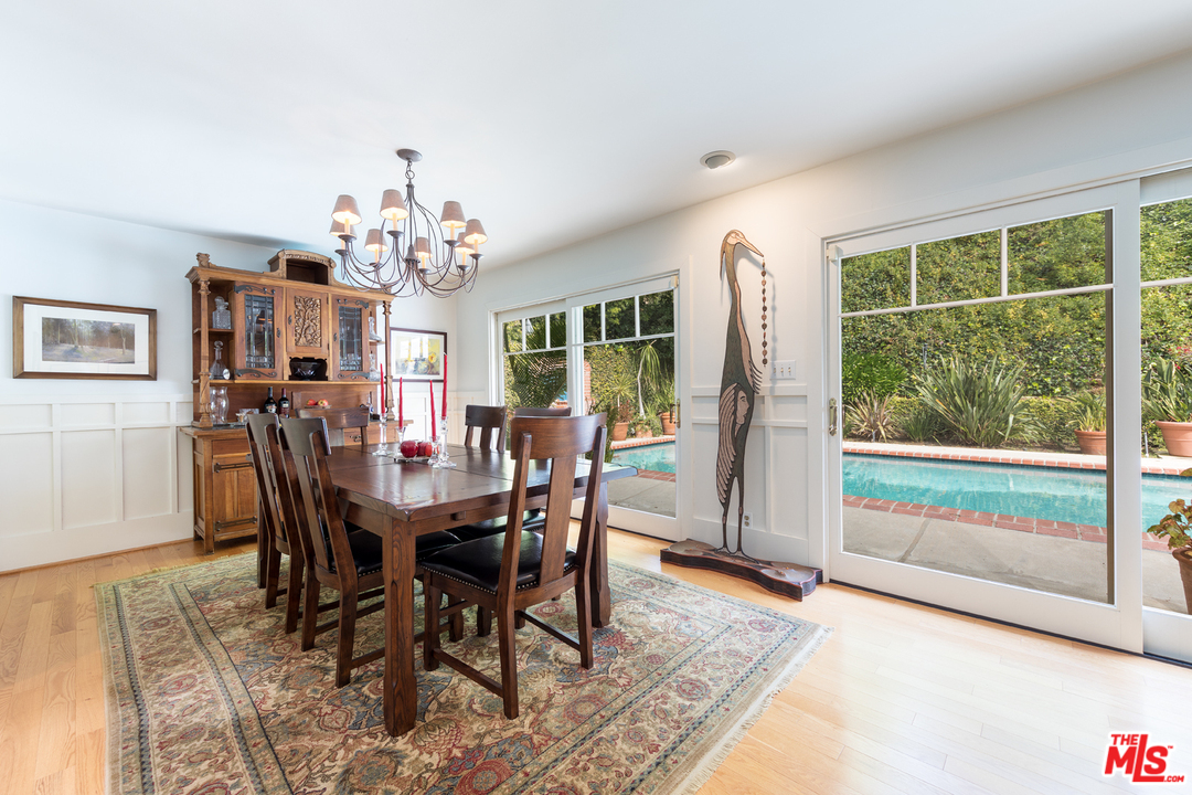 1826 Roscomare Road Los Angeles, CA 90077 - Photo 5 of 12 a view of a dining room with furniture window and wooden floor