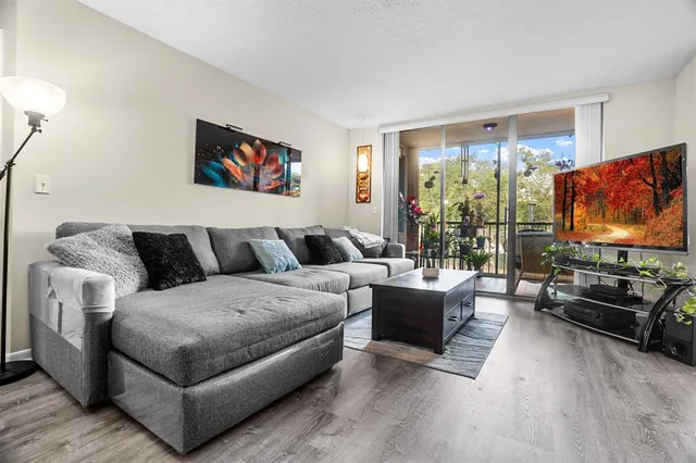 a bedroom with furniture and a closet