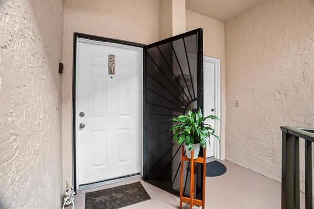 an aerial view of a house with garden space and lake view