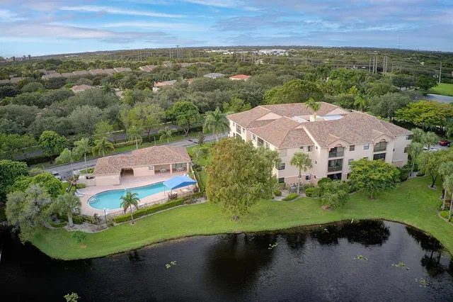 a front view of house and yard with green space