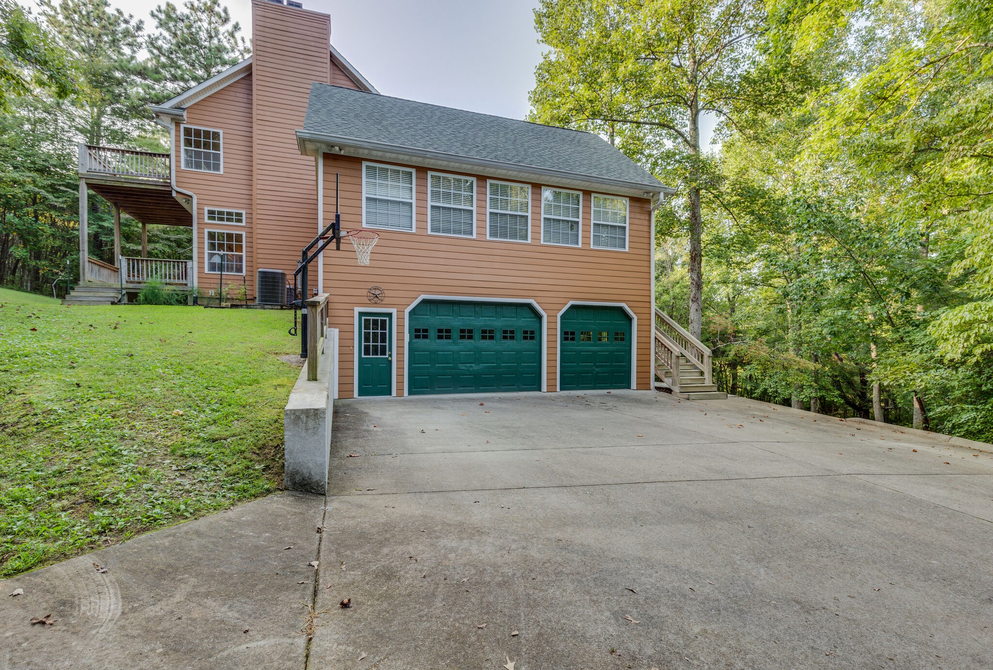 7430 Sleepy Hollow Road Fairview, TN 37062 - Photo 4 of 46 a front view of a house with a yard and garage