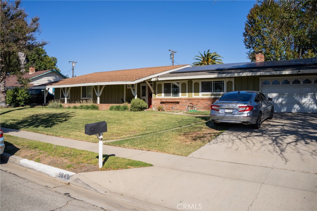 5649 North Riverside Avenue Rialto, CA 92377 - Photo 1 of 1 a front view of a house with a yard and fountain