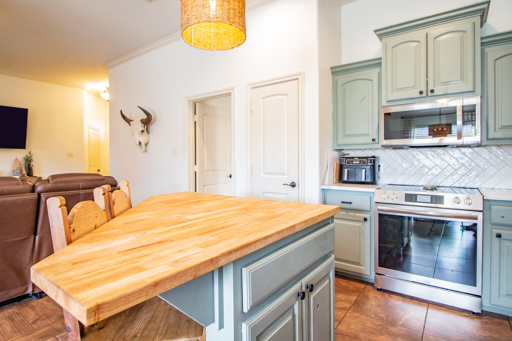 3013 110th Street Lubbock, TX 79423 - Photo 11 of 22 a bedroom with a bed and a dresser