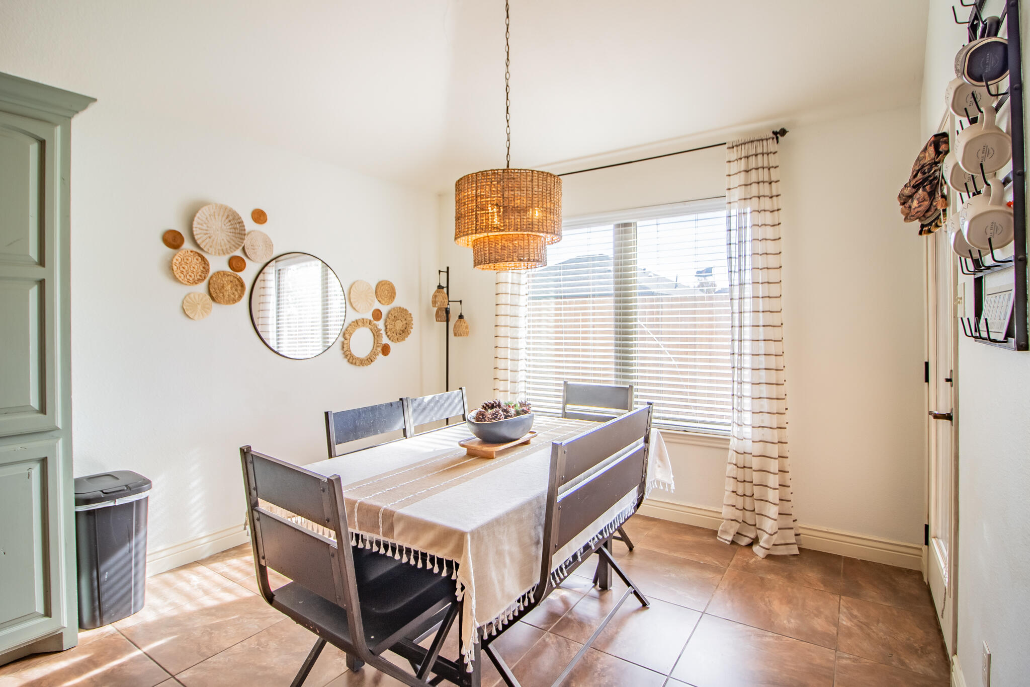 3013 110th Street Lubbock, TX 79423 - Photo 12 of 22 a dining room with wooden floor and a chandelier