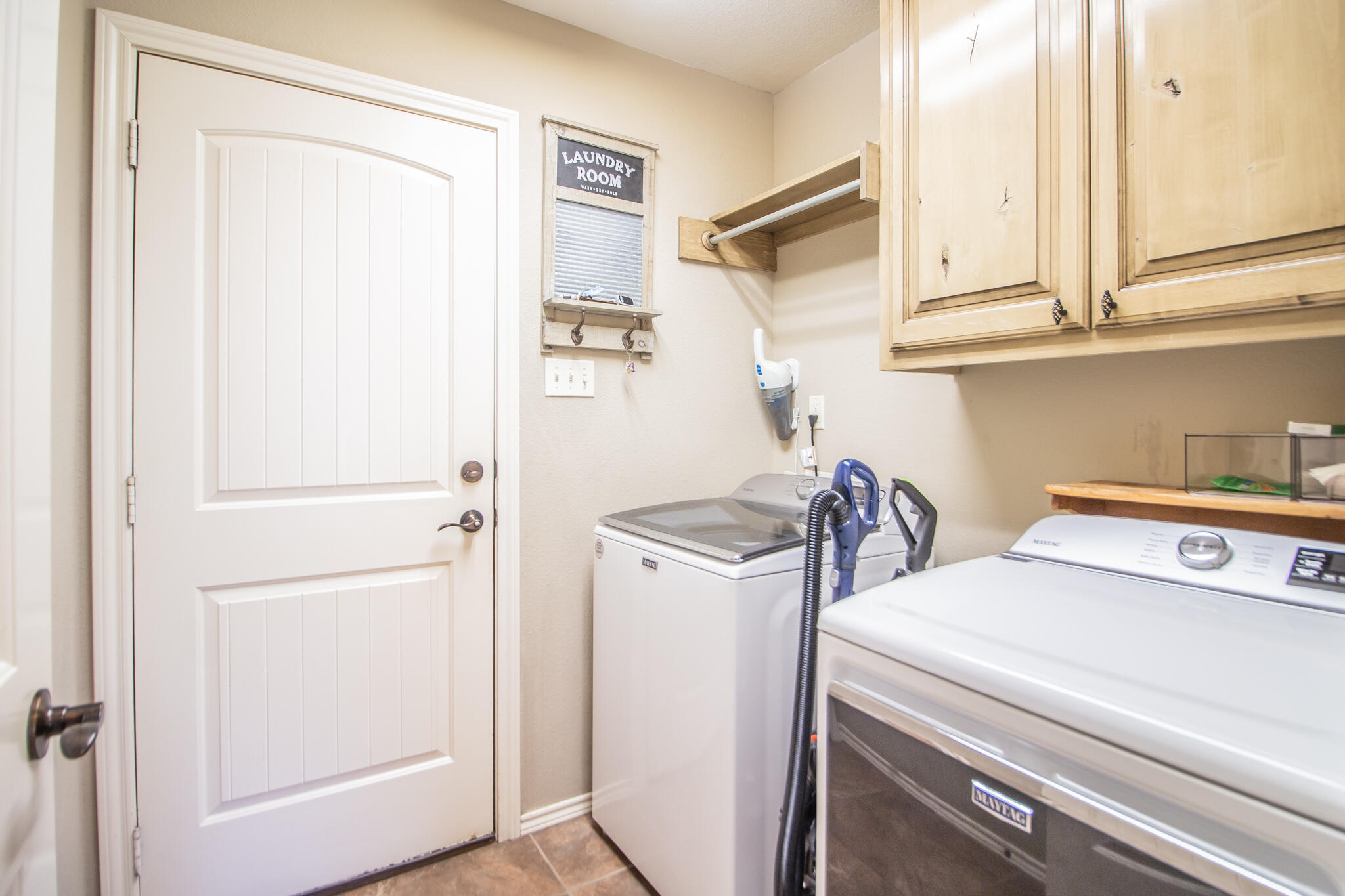 3013 110th Street Lubbock, TX 79423 - Photo 13 of 22 a utility room with dryer and washer