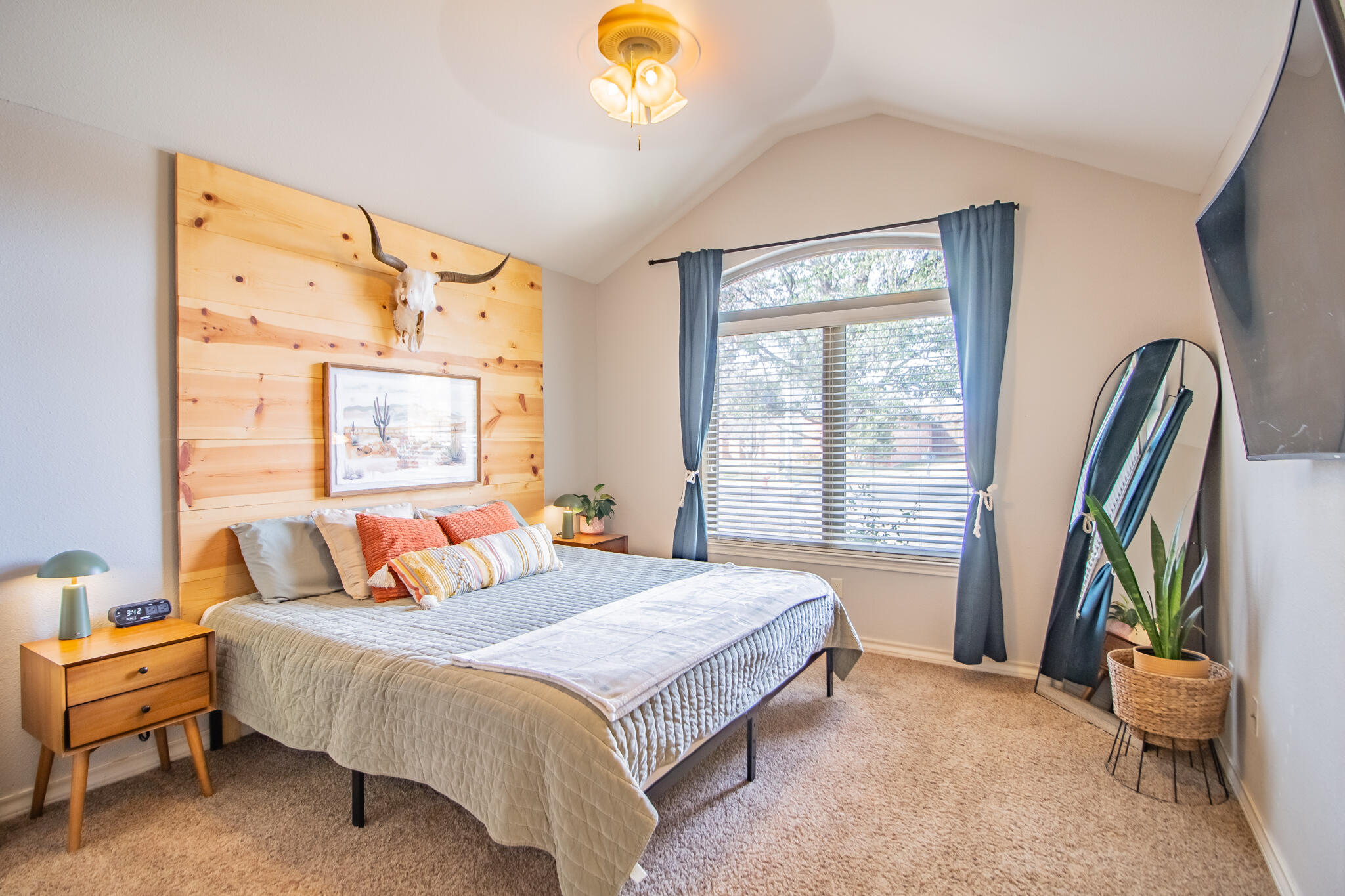 3013 110th Street Lubbock, TX 79423 - Photo 18 of 22 a bedroom with a bed and a window