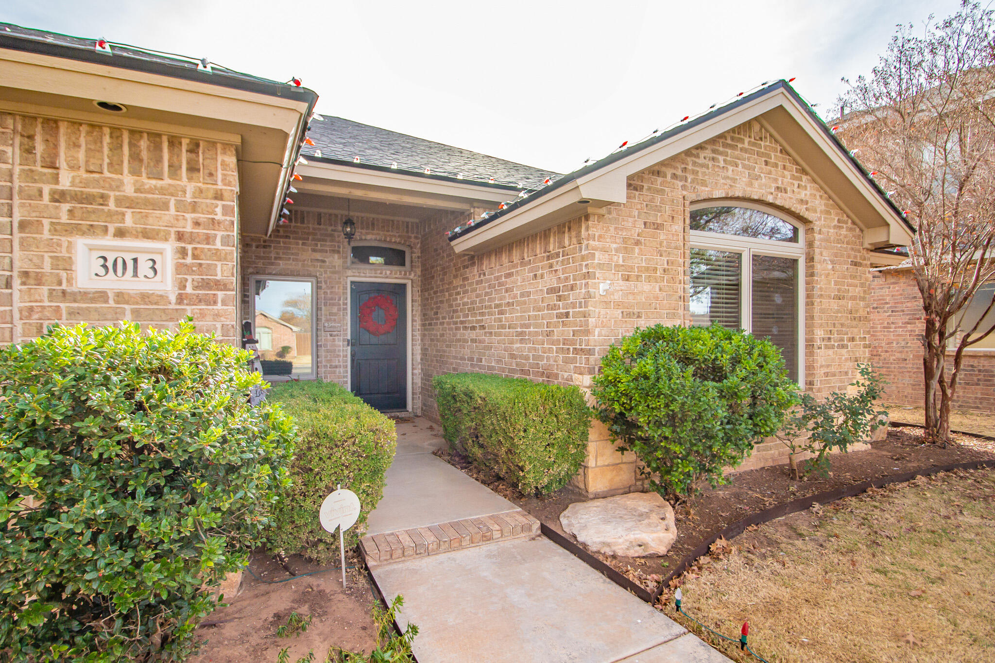 3013 110th Street Lubbock, TX 79423 - Photo 3 of 22 a front view of a house with a yard