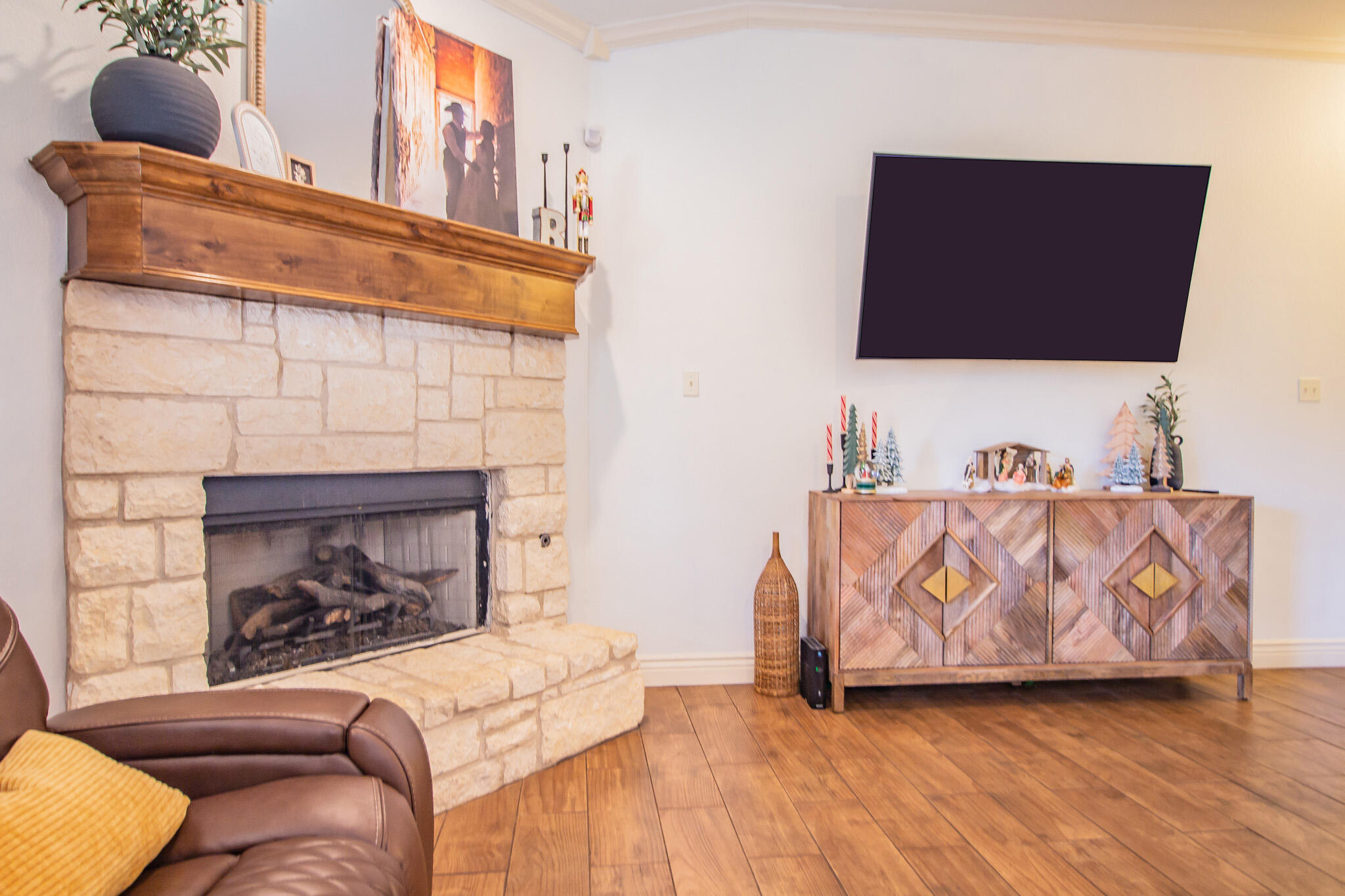3013 110th Street Lubbock, TX 79423 - Photo 6 of 22 a living room with furniture and a fireplace