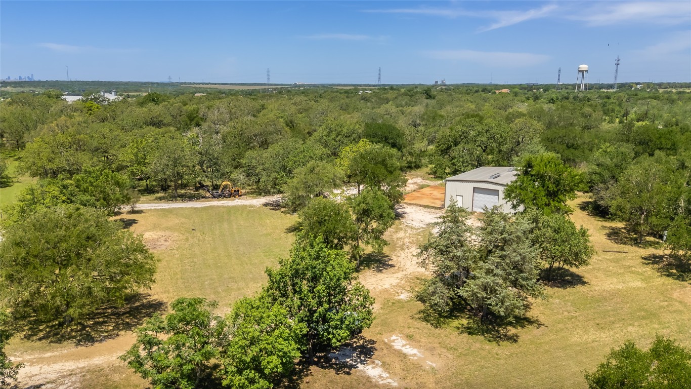 7502 Wells Trace Manor, TX 78653 - Photo 2 of 31 a view of a lake with houses in the back