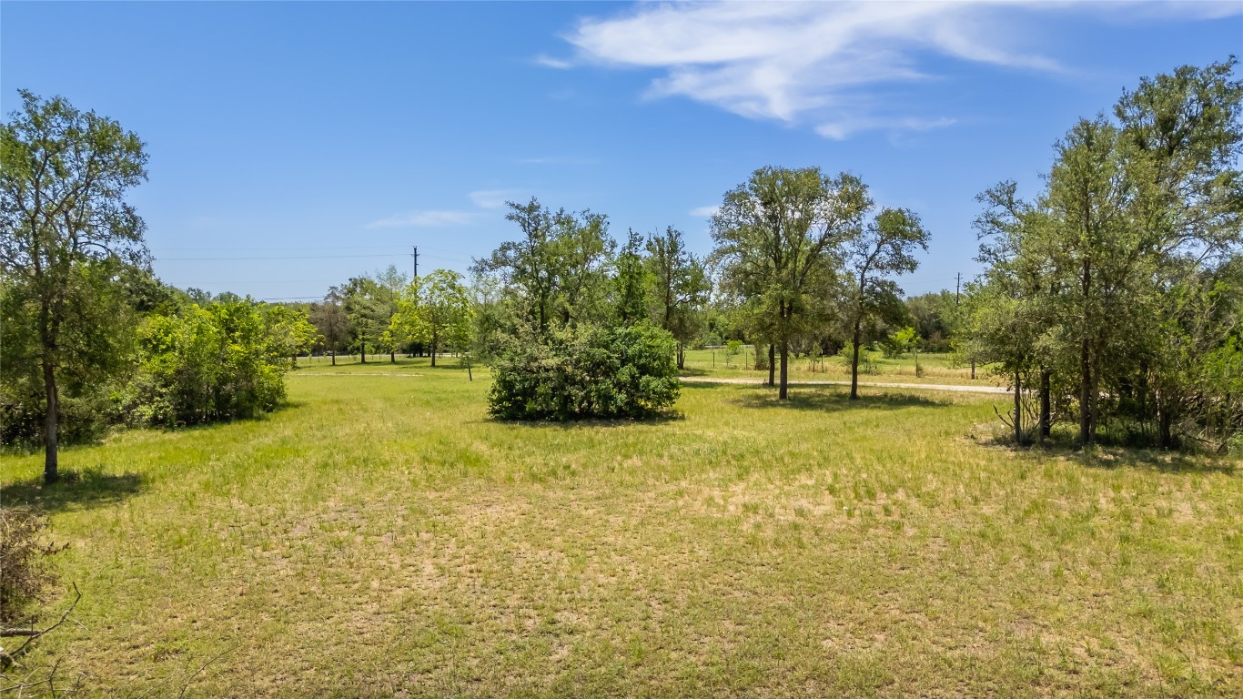 7502 Wells Trace Manor, TX 78653 - Photo 26 of 31 a view of yard with swimming pool and trees