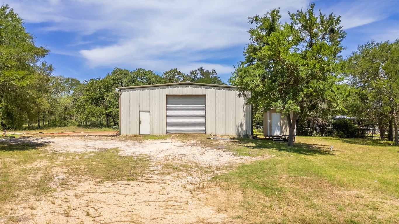 7502 Wells Trace Manor, TX 78653 - Photo 4 of 31 a view of a house with a yard and tree s