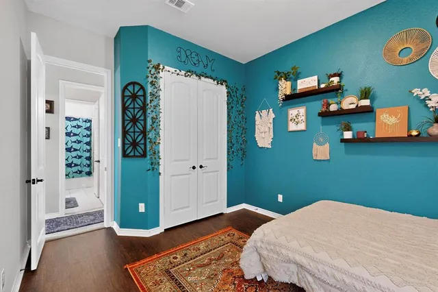 a bedroom with a bed and ceiling fan