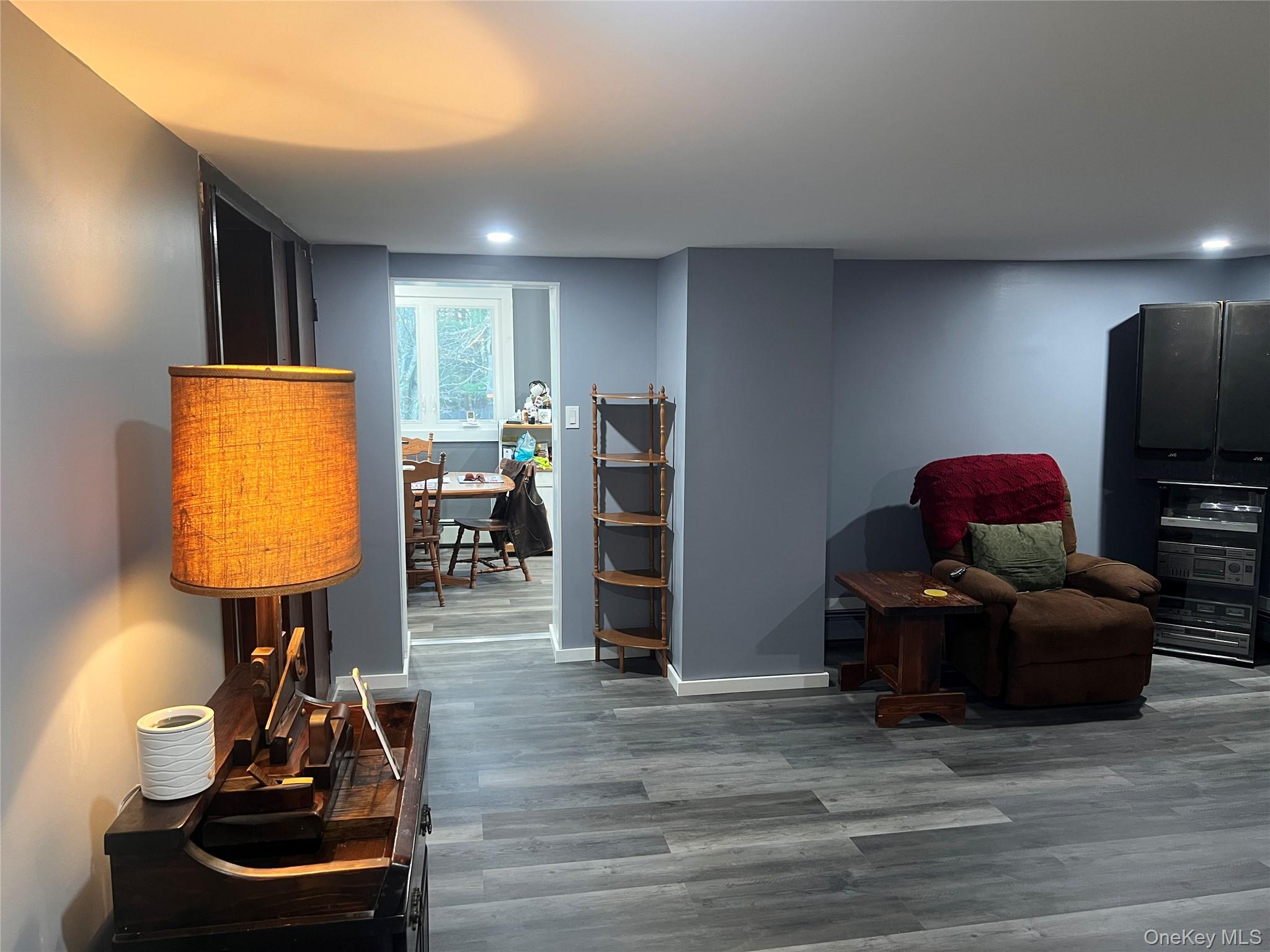 279 Cold Spring Road Monticello, NY 12701 - Photo 10 of 32 Living area featuring wood finished floors and baseboards