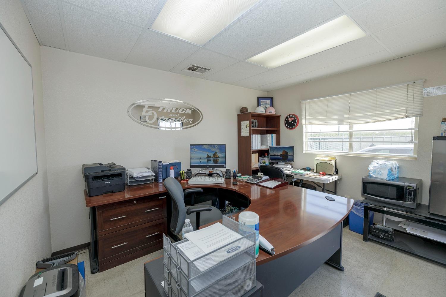 7831 Crows Landing Road Ceres, CA 95307 - Photo 13 of 23 a living room with furniture a window and a flat screen tv
