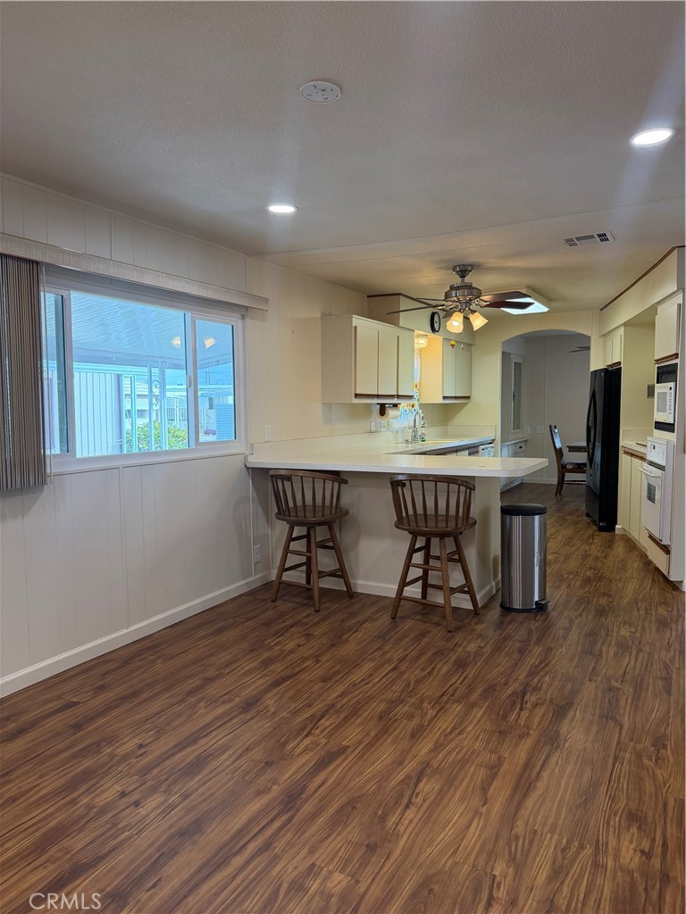 12101 Dale Avenue, Unit 44 Stanton, CA 90680 - Photo 3 of 14 a room with furniture and wooden floor