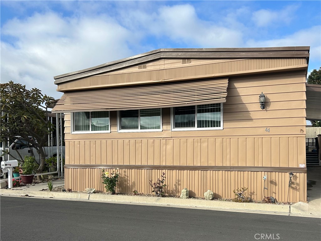 12101 Dale Avenue, Unit 44 Stanton, CA 90680 - Photo 5 of 14 a view of a house with a small yard