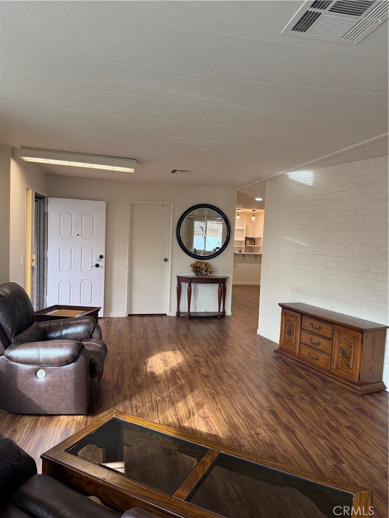 12101 Dale Avenue, Unit 44 Stanton, CA 90680 - Photo 6 of 14 a living room with furniture and a wooden floor
