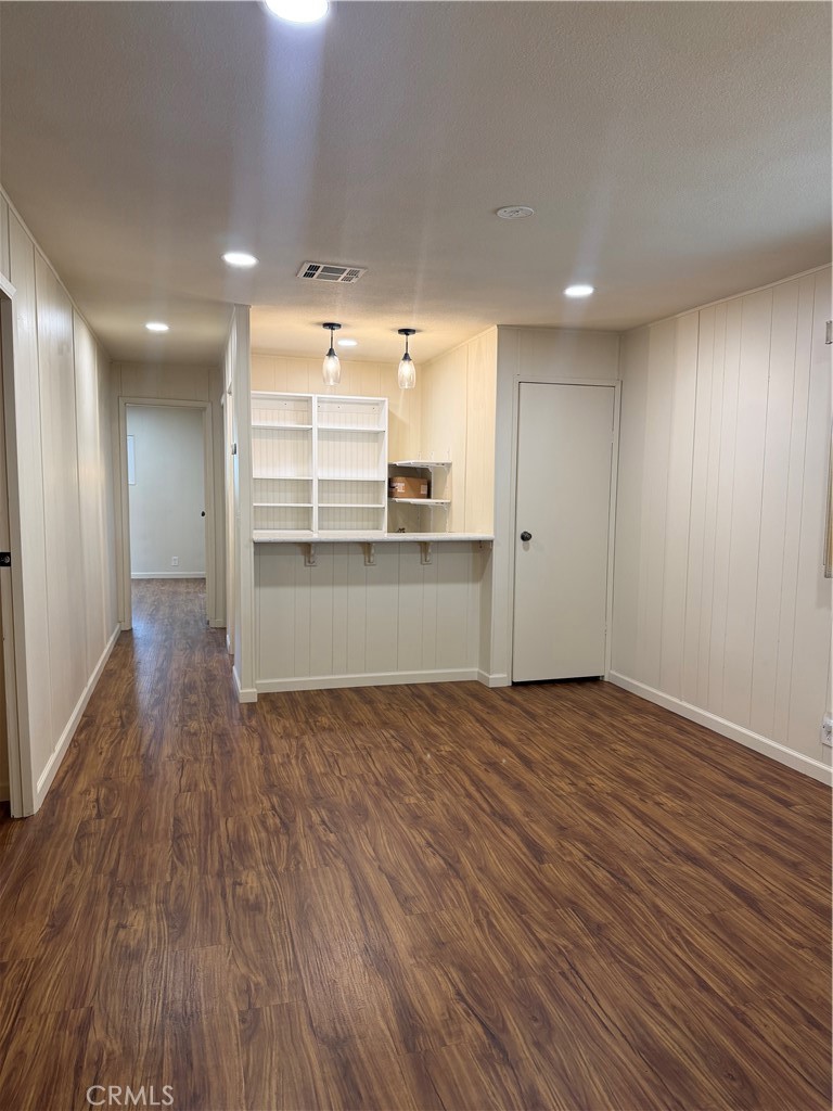 12101 Dale Avenue, Unit 44 Stanton, CA 90680 - Photo 8 of 14 a view of a kitchen with a sink and wooden floor