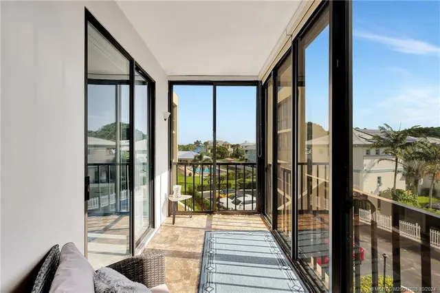 a bedroom with a large bed a chandelier and closet