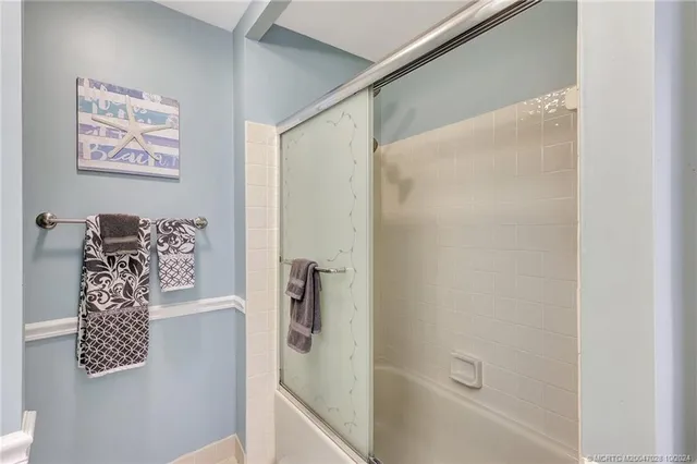 a spacious bathroom with a granite countertop sink mirror and