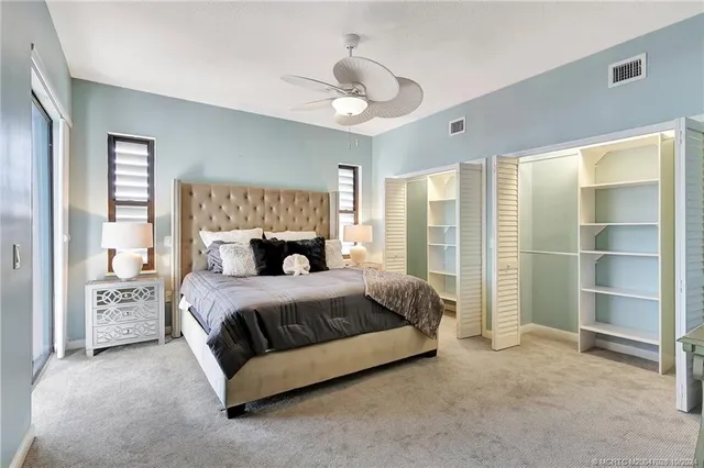 a view of washer and dryer with kitchen in the background
