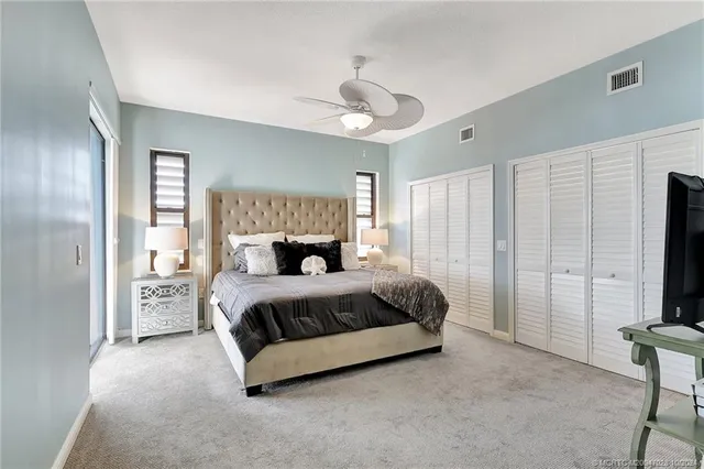 a dining room with furniture and floor to ceiling windows