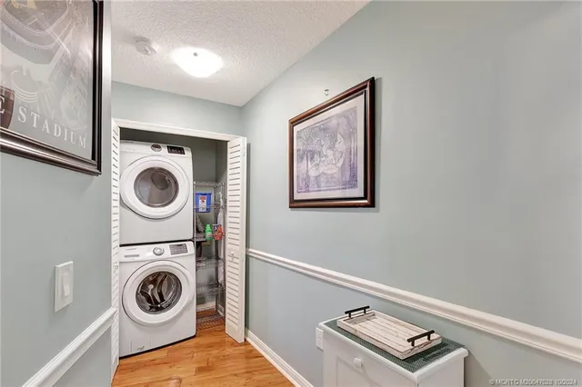 an aerial view of a house with outdoor space and lake view
