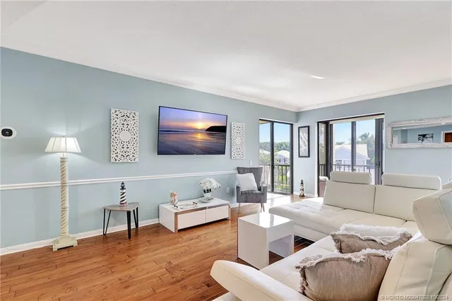 a living room with fireplace furniture and a flat screen tv