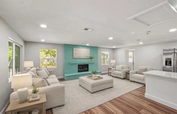 a living room with furniture and a fireplace