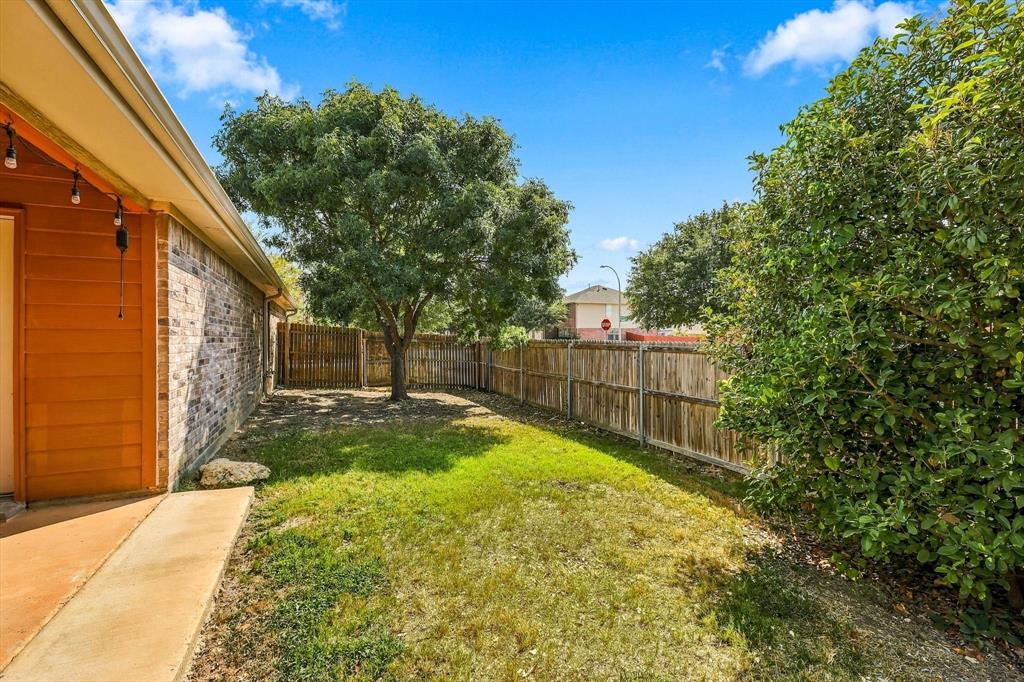 4301 Grassmere Road Fort Worth, TX 76244 - Photo 38 of 40 Grassy side yard great for kids or pets.