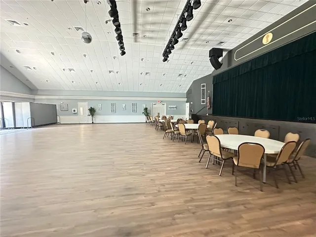 a view of outdoor kitchen with outdoor seating