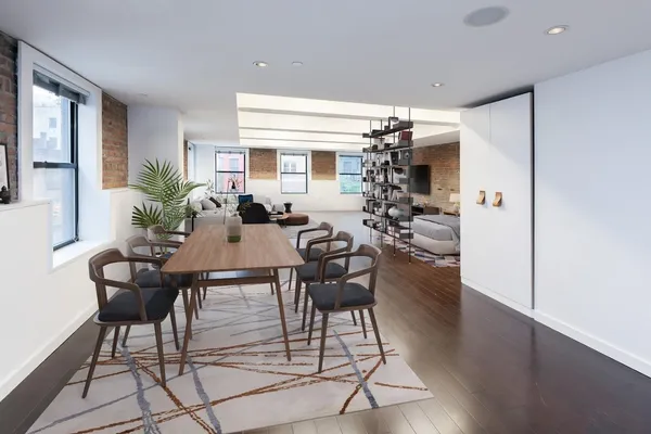 a living room with furniture wooden floor and a flat screen tv