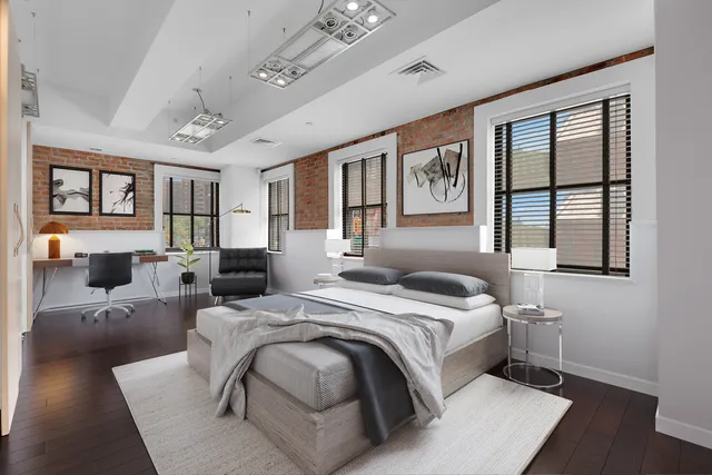 a kitchen with stainless steel appliances granite countertop a refrigerator a sink dishwasher and a stove with wooden floor