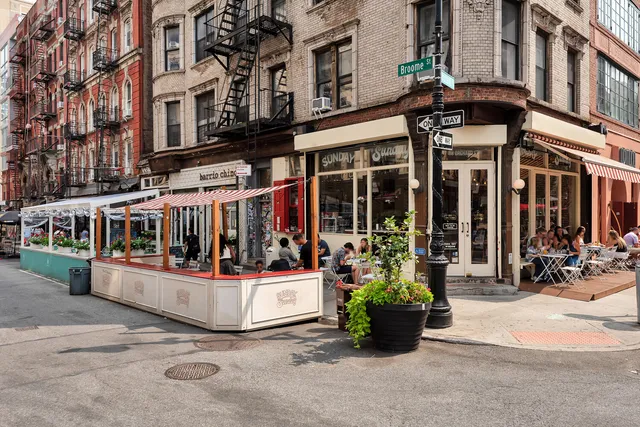 a kitchen with a stove and a refrigerator