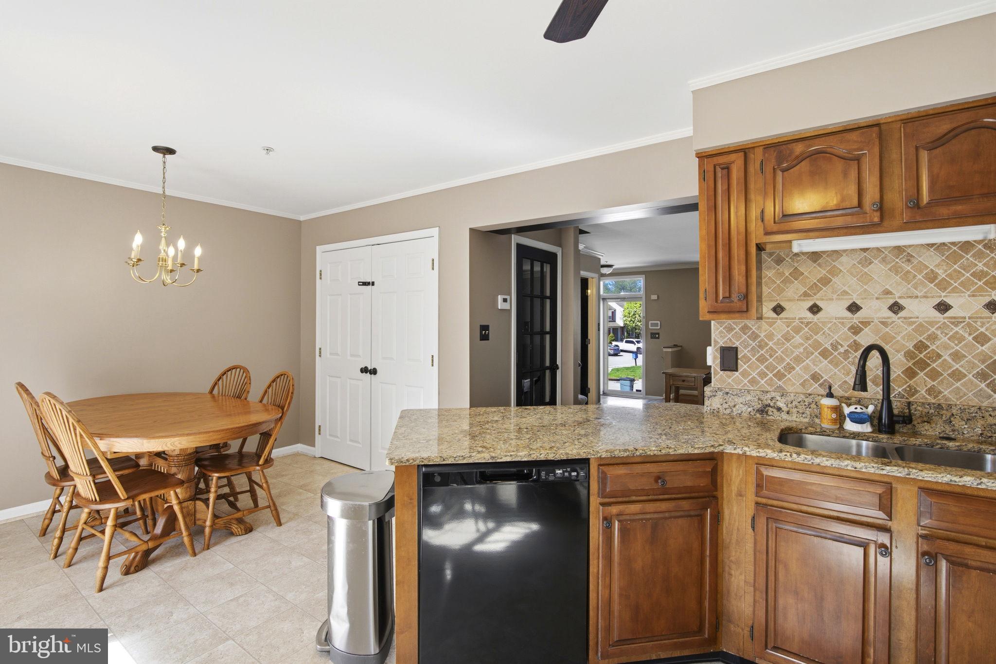2005 Pointview Circle Forest Hill, MD 21050 - Photo 8 of 32 a kitchen with granite countertop white cabinets and chairs