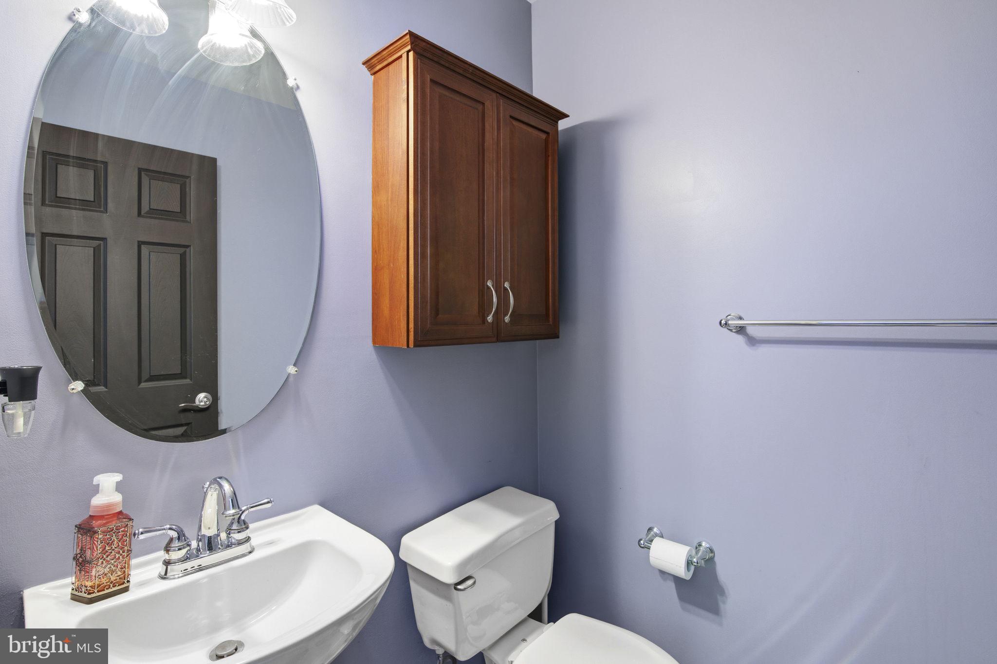 2005 Pointview Circle Forest Hill, MD 21050 - Photo 9 of 32 a bathroom with a toilet sink and mirror