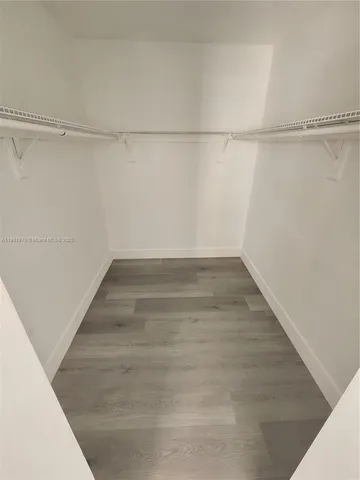 a view of an empty walk in closet