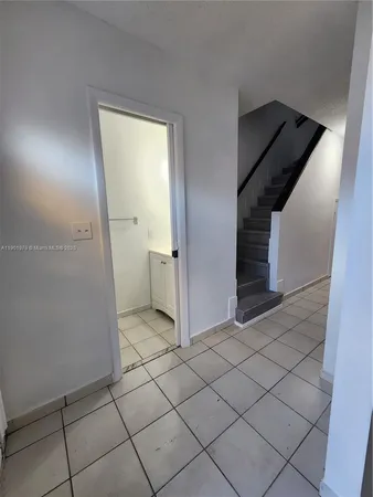 a view of a livingroom and a hallway